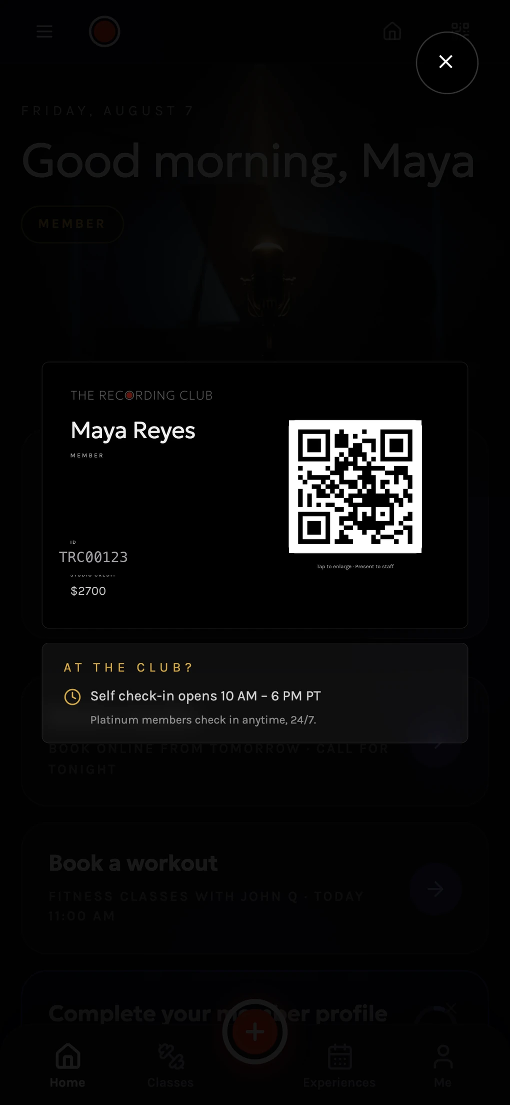 The matte-black membership card with live credit balance and a fresh QR credential